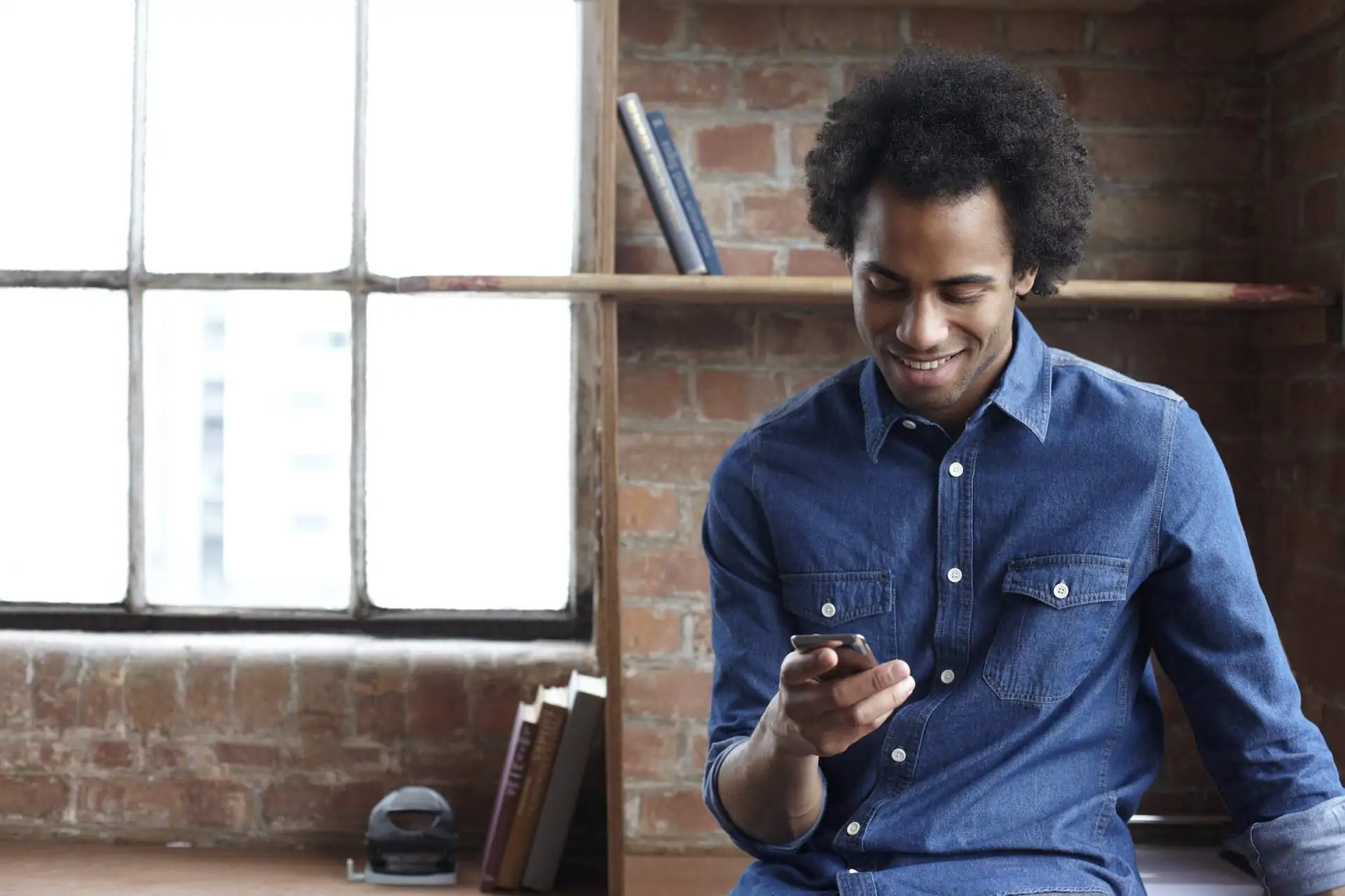 Young person direct messaging with a restaurant on their phone