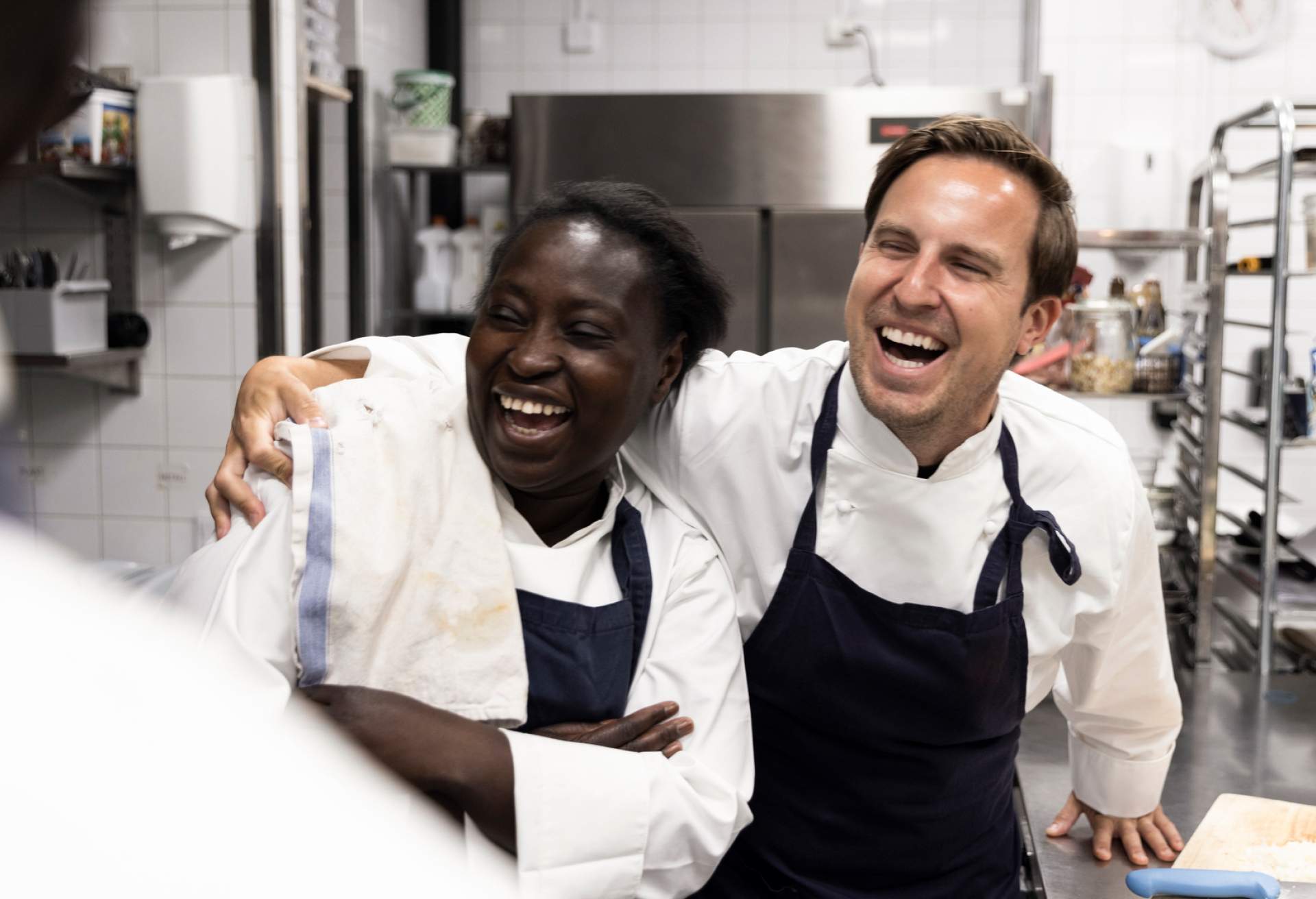 Employees laughing during restaurant training