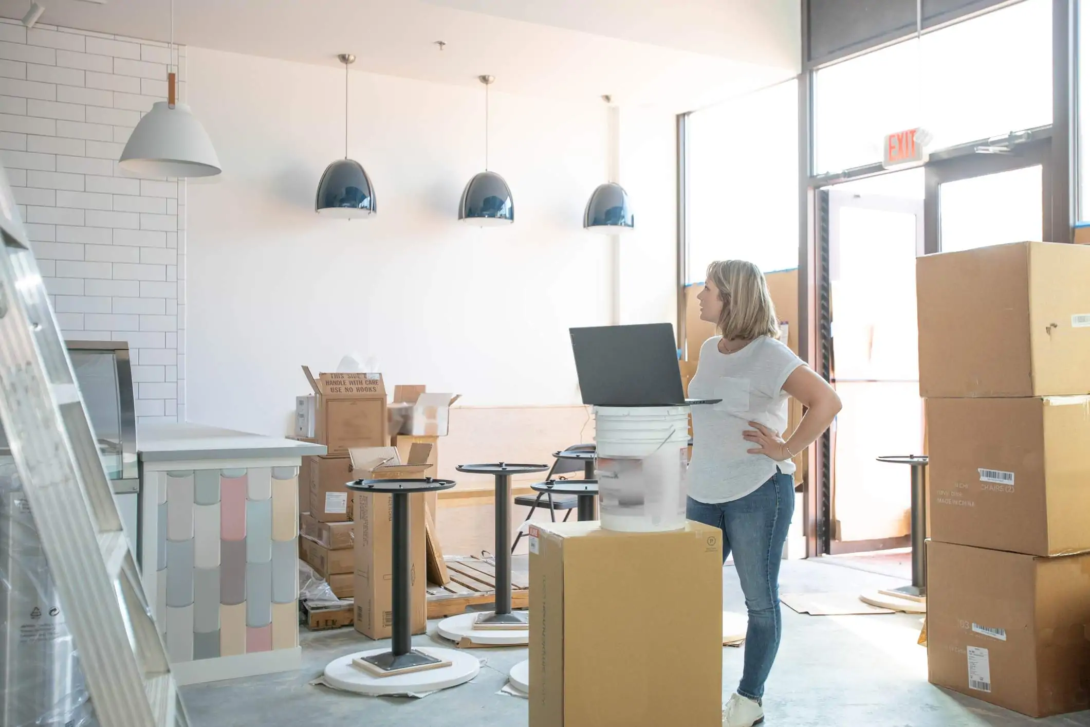 Image depicts a restaurant worker in a new restaurant.