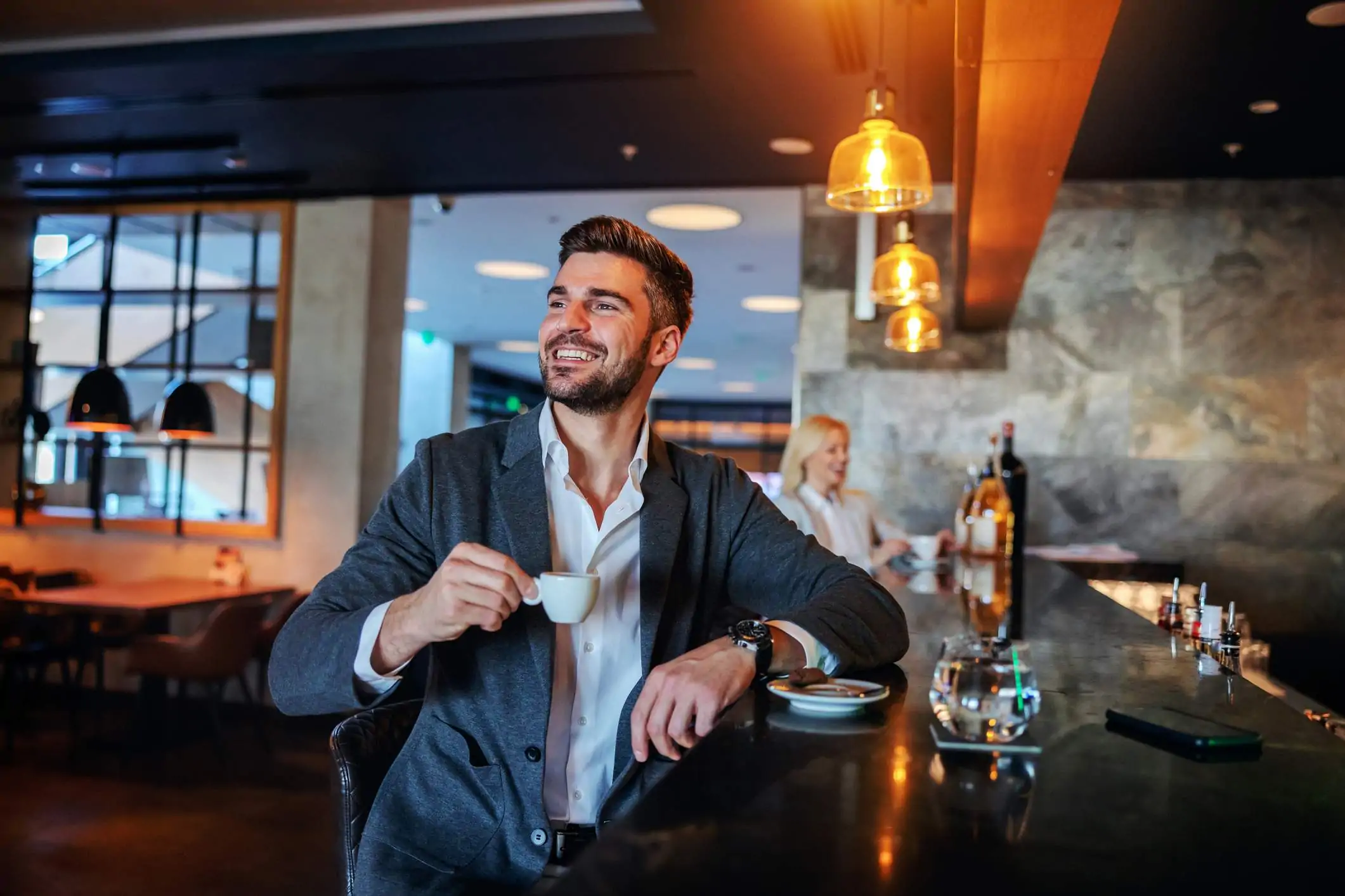 Image depicts a diner having a coffee.