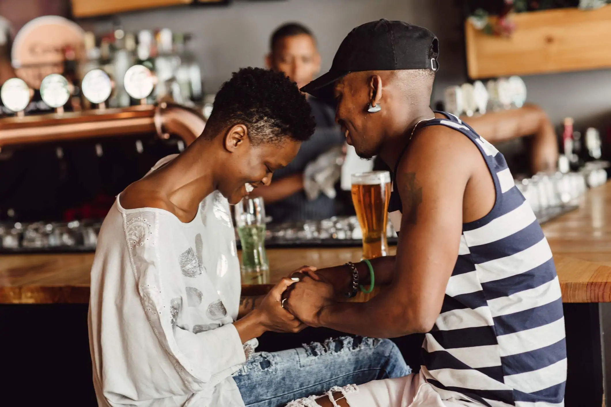 Image depicts two diners sitting at a bar.