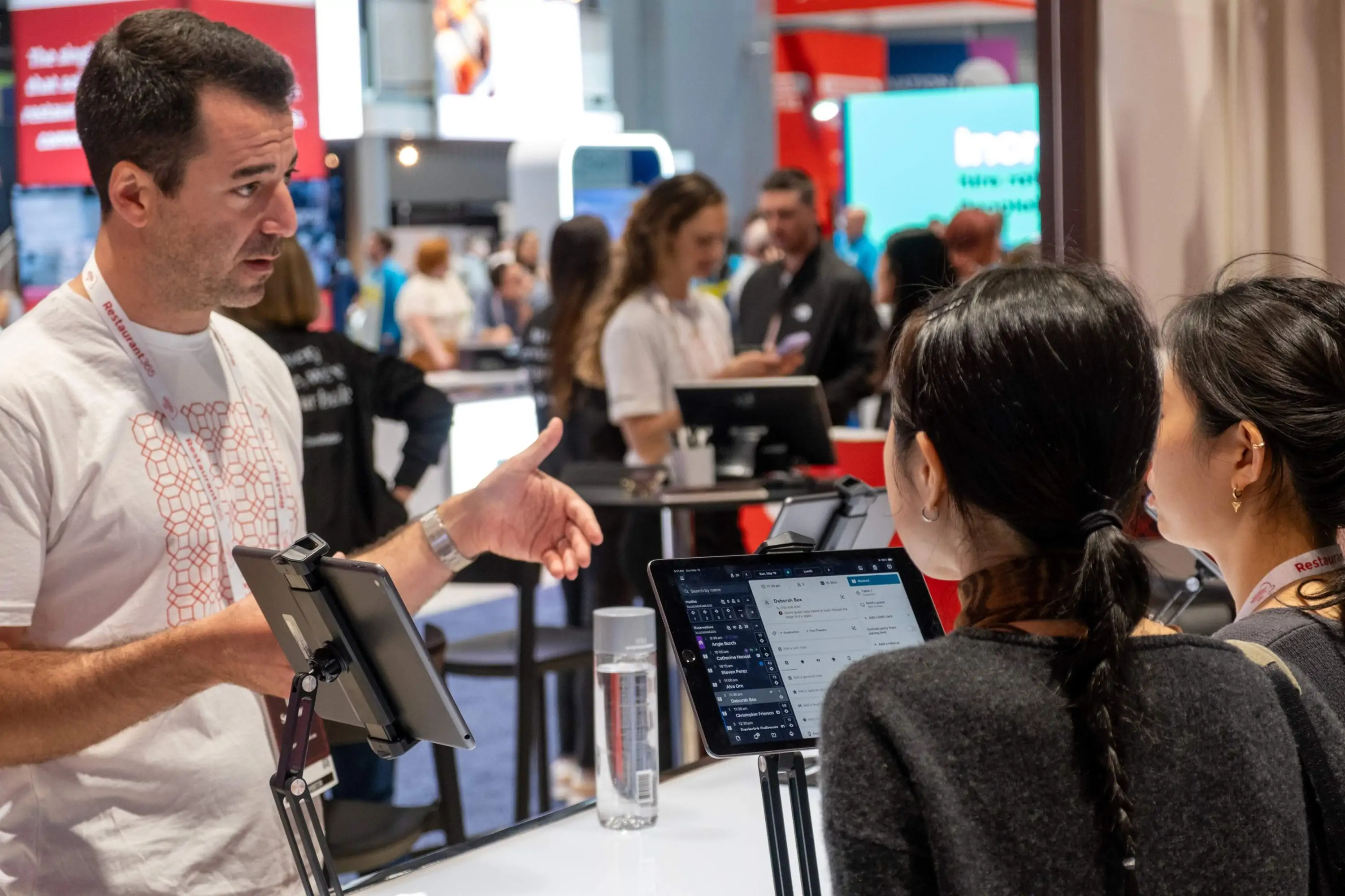 Man gives a product demo at a conference